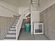 A garage featuring stairs, storage space, and a convenient chair lift for accessibility at 1975 Wild Star Way, Castle Rock, CO 80104