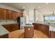 Spacious kitchen boasts stainless steel appliances, granite countertops, and a functional center island at 1975 Wild Star Way, Castle Rock, CO 80104