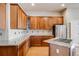 Updated kitchen features custom cabinets, granite counters, stainless steel appliances, and hardwood floors at 1975 Wild Star Way, Castle Rock, CO 80104