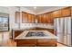 Updated kitchen with stainless steel refrigerator and granite countertops with gas cooktop at 1975 Wild Star Way, Castle Rock, CO 80104