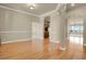 Spacious living area with hardwood floors and an open layout with connecting rooms at 1975 Wild Star Way, Castle Rock, CO 80104