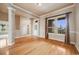 Bright living room with hardwood floors, white trim, large windows and neutral paint at 1975 Wild Star Way, Castle Rock, CO 80104