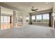 Open-concept living room with carpet floors, a fireplace, and abundant natural light at 1975 Wild Star Way, Castle Rock, CO 80104