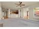 Bright living room with hardwood floors, carpeted floors, fireplace, and abundant natural light at 1975 Wild Star Way, Castle Rock, CO 80104