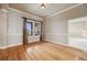 Cozy living room with hardwood floors and large windows, offering beautiful views and plenty of natural light at 1975 Wild Star Way, Castle Rock, CO 80104