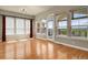 Bright living room with hardwood floors, large windows, and natural light at 1975 Wild Star Way, Castle Rock, CO 80104