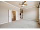Empty room featuring light-colored walls, carpet, and two doorways at 1975 Wild Star Way, Castle Rock, CO 80104