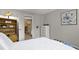 Cozy bedroom with built in shelves, white comforter and trim, and decor that makes the space feel very comfy at 1320 S Monaco St Pkwy # 3, Denver, CO 80224