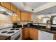 Well-equipped kitchen features dark countertops and essential appliances at 1320 S Monaco St Pkwy # 3, Denver, CO 80224