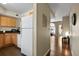 Open kitchen layout with white appliances seamlessly connects to the living area at 1320 S Monaco St Pkwy # 3, Denver, CO 80224