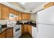 Functional kitchen equipped with white appliances and ample cabinet space at 1320 S Monaco St Pkwy # 3, Denver, CO 80224