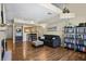 Comfortable living room with a contemporary sofa, wood flooring, and a view of the kitchen at 1320 S Monaco St Pkwy # 3, Denver, CO 80224