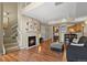 Inviting living room with a cozy fireplace and an open layout to the kitchen area at 1320 S Monaco St Pkwy # 3, Denver, CO 80224