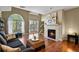 Inviting living room features a fireplace, large window, and hardwood floors at 1320 S Monaco St Pkwy # 3, Denver, CO 80224
