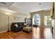 The living area features hardwood floors and a large arched window at 1320 S Monaco St Pkwy # 3, Denver, CO 80224