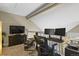 Upstairs loft features a home office setup with sleek monitors and plenty of light at 1320 S Monaco St Pkwy # 3, Denver, CO 80224