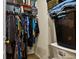 Walk-in closet with closet organizer, hanging clothes, shelves, baskets, and some clothing articles at 1320 S Monaco St Pkwy # 3, Denver, CO 80224