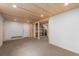 Finished basement area featuring wood ceiling and carpeted floor, ready for customization and versatile use at 13609 Elsie Rd, Conifer, CO 80433