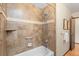 Cozy bathroom featuring a tiled shower and tub combo at 13609 Elsie Rd, Conifer, CO 80433