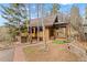 Charming brown two-story home with a quaint front yard and a delightful slide at 13609 Elsie Rd, Conifer, CO 80433