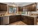 Spacious kitchen with granite countertops, ample cabinetry, and a view of the surrounding landscape at 13609 Elsie Rd, Conifer, CO 80433
