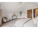 Bright main bedroom featuring a seating area, a console table, and neutral decor at 13609 Elsie Rd, Conifer, CO 80433