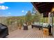 Spacious patio area with outdoor furniture and beautiful views of the surrounding landscape at 13609 Elsie Rd, Conifer, CO 80433