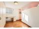 Bedroom featuring hardwood floors, storage, and a workspace with natural light at 1833 N Williams St # 402, Denver, CO 80218