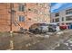 Exterior of building with reserved parking spot and snow in the area at 1833 N Williams St # 402, Denver, CO 80218
