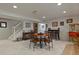 Basement featuring a dining table, decor, and popcorn machine, stairs to upper level, and tile flooring section at 11839 Saddleback Ct, Parker, CO 80138