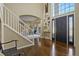 Welcoming foyer with high ceilings, hardwood floors, and a view into the living room at 11839 Saddleback Ct, Parker, CO 80138
