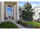 Inviting front porch with stone accents, decorative plants, and a charming bench at 11839 Saddleback Ct, Parker, CO 80138