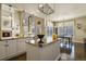 Kitchen features a fireplace and opens to a dining area with island and granite countertops at 11839 Saddleback Ct, Parker, CO 80138