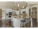 Bright kitchen with a large center island, modern appliances, and granite countertops at 11839 Saddleback Ct, Parker, CO 80138
