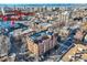 Apartment building with an aerial view including nearby stores at 1008 N Corona St # 205, Denver, CO 80218