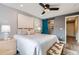 Bedroom with ceiling fan, sliding closet door, and bright natural light at 1008 N Corona St # 205, Denver, CO 80218