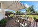 Backyard patio area with dining set and comfortable seating, perfect for outdoor entertaining at 707 Uvalda St, Aurora, CO 80011