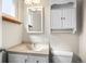 Clean bathroom featuring a vanity with a mirror and a toilet at 707 Uvalda St, Aurora, CO 80011