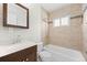 Bathroom features a shower, vanity, and modern finishes at 707 Uvalda St, Aurora, CO 80011