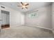 This bedroom features a ceiling fan and closet at 707 Uvalda St, Aurora, CO 80011