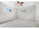 Bright bedroom with carpeted floors and a ceiling fan at 707 Uvalda St, Aurora, CO 80011