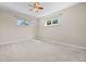 Inviting bedroom with ample natural light and carpeted flooring at 707 Uvalda St, Aurora, CO 80011