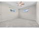 This bright bedroom features a ceiling fan and dual windows at 707 Uvalda St, Aurora, CO 80011
