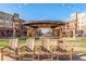Outdoor shot of a common area in a community with a stage and lawn chairs at 707 Uvalda St, Aurora, CO 80011