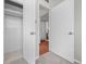 Hallway view features a bedroom and bathroom at 707 Uvalda St, Aurora, CO 80011