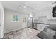 White kitchen features stainless steel appliances and a door to the exterior at 707 Uvalda St, Aurora, CO 80011
