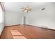 Spacious living room featuring beautiful hardwood floors and a ceiling fan at 707 Uvalda St, Aurora, CO 80011
