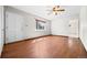 Bright, open living room with wood floors and a ceiling fan at 707 Uvalda St, Aurora, CO 80011