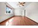 Bright living room featuring hardwood floors and natural light at 707 Uvalda St, Aurora, CO 80011