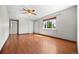 Spacious living room featuring gleaming hardwood floors and natural light at 707 Uvalda St, Aurora, CO 80011